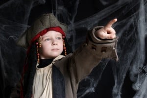 Little boy wearing pirate costume