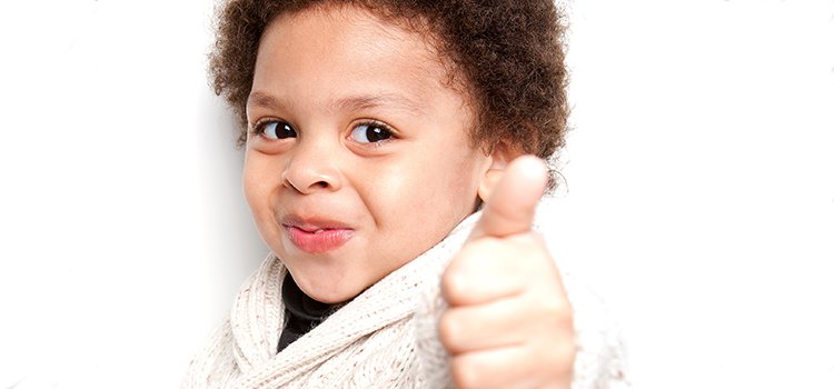 boy giving thumbs up to his favorite camp