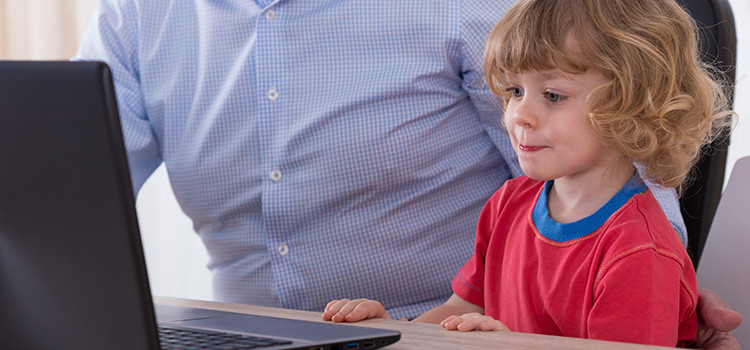 kid and grandpa checking out websites